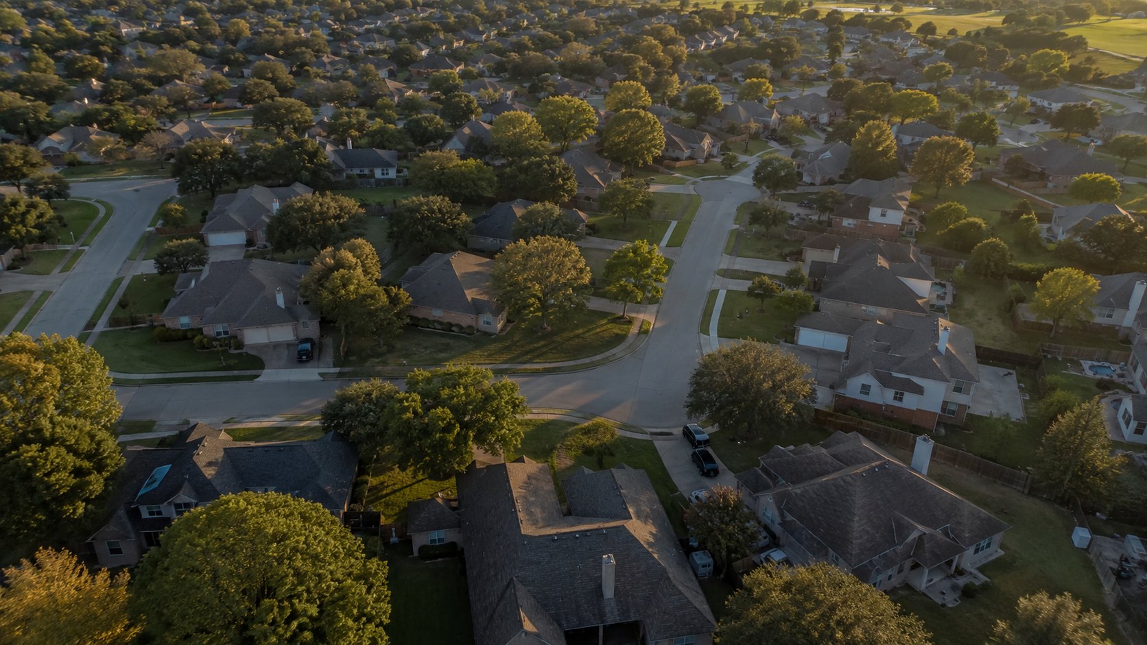 An aerial view of a North Texas suburb at golden hour